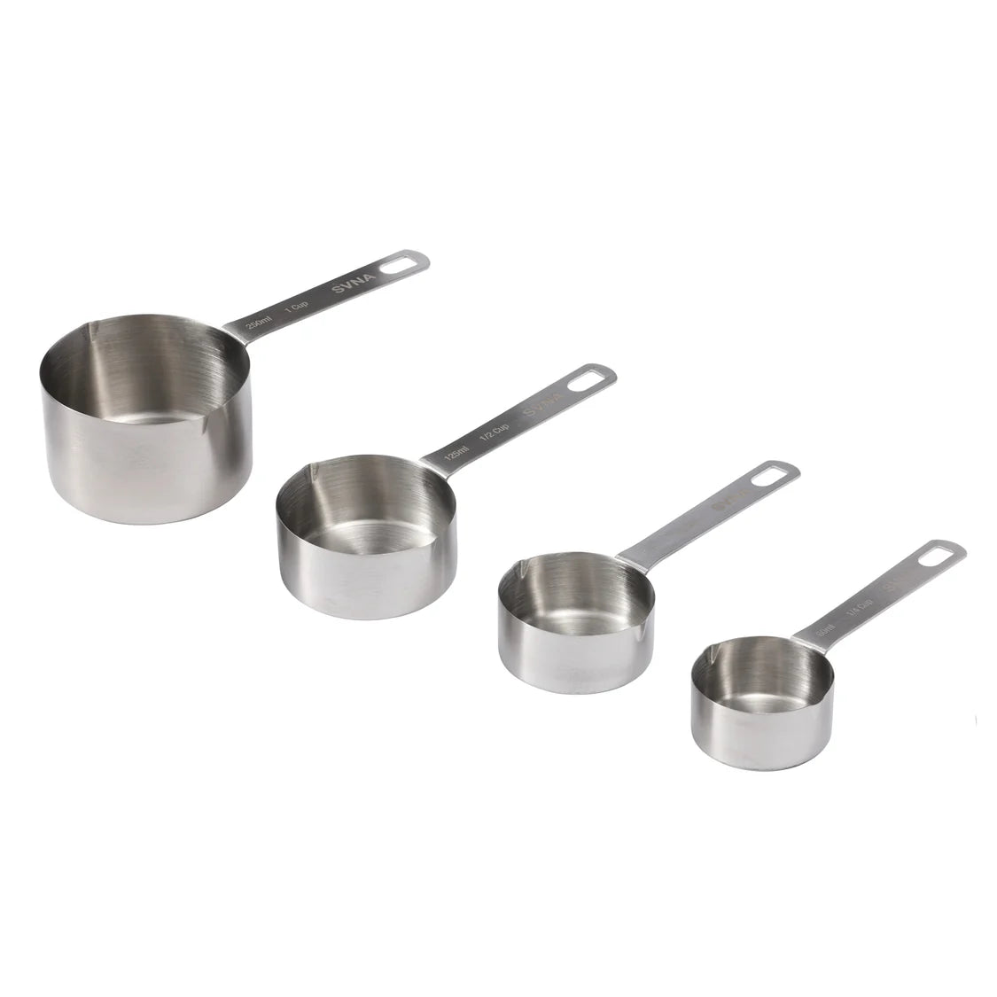 Set of four stainless steel measuring cups on a white background