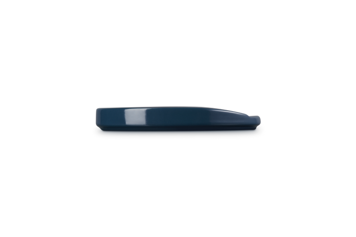 Navy blue spoon rest on a white background