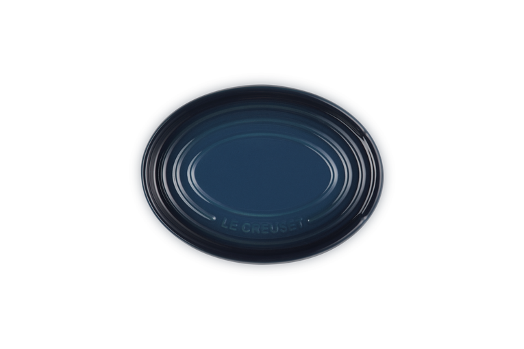 Navy Blue ceramic spoon rest on a white background