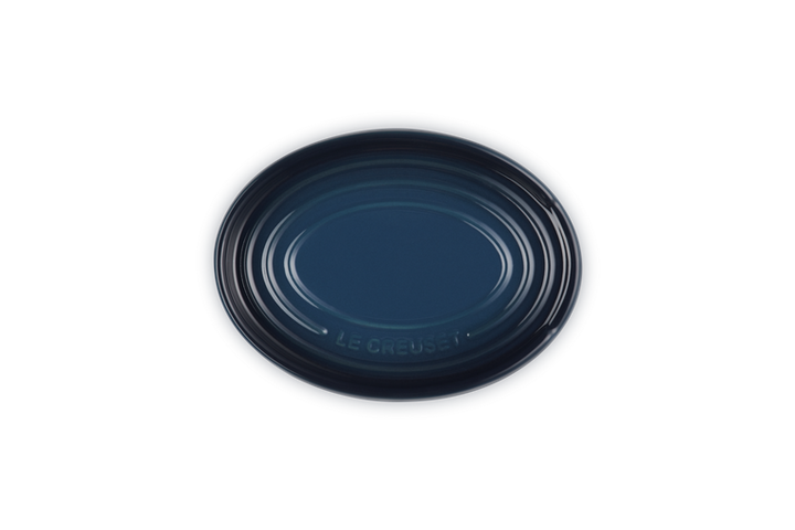 Navy Blue ceramic spoon rest on a white background