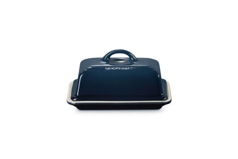Blue butter dish with lid on a white background