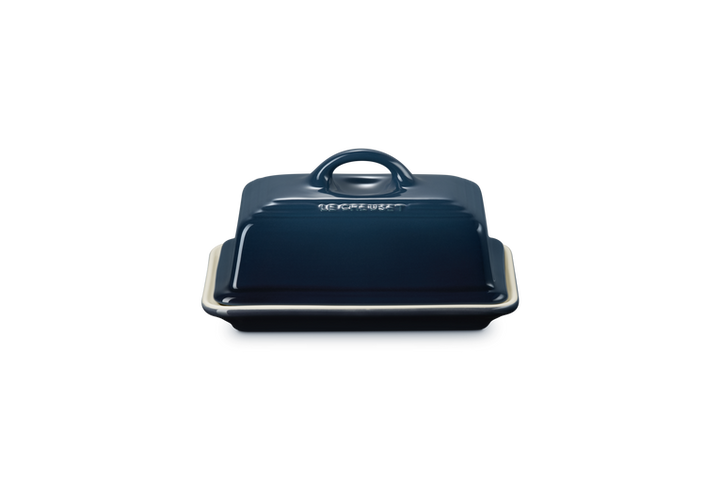 Blue butter dish with lid on a white background