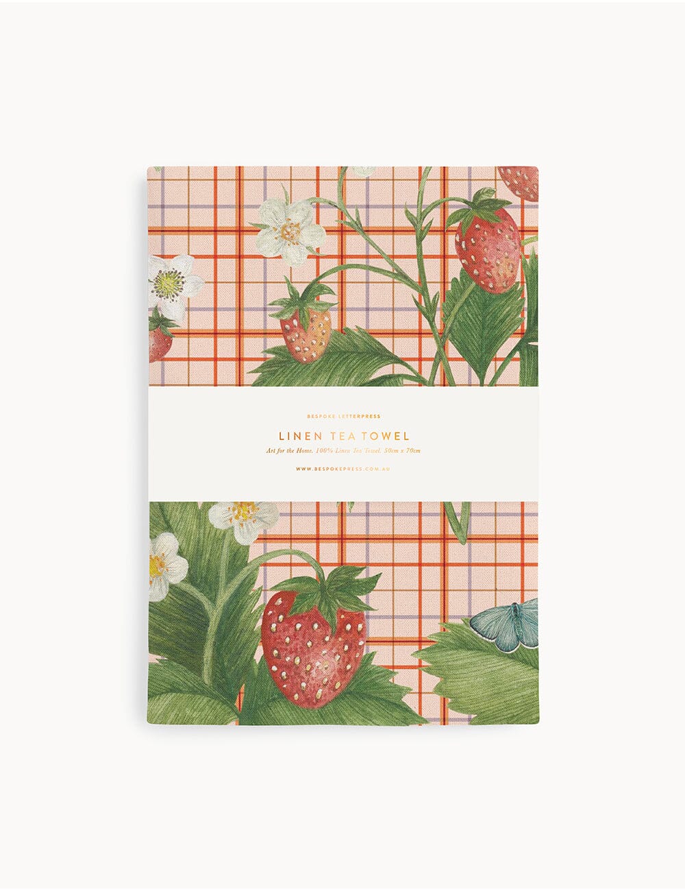 Pack of linen tea towels with strawberry and plaid design on a white background