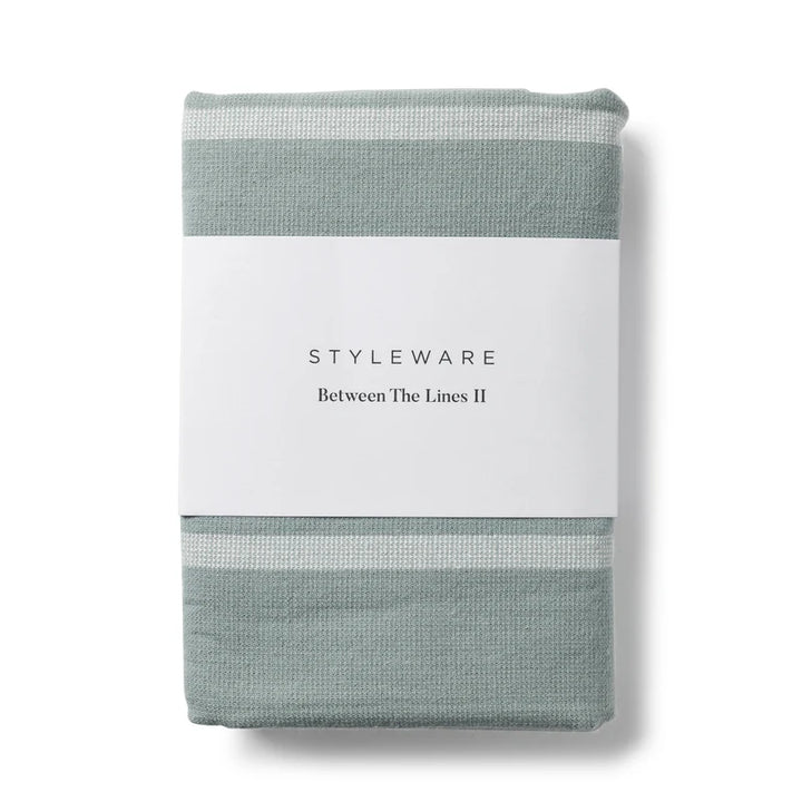 Folded tea towel with 'Styleware' branding on a white background