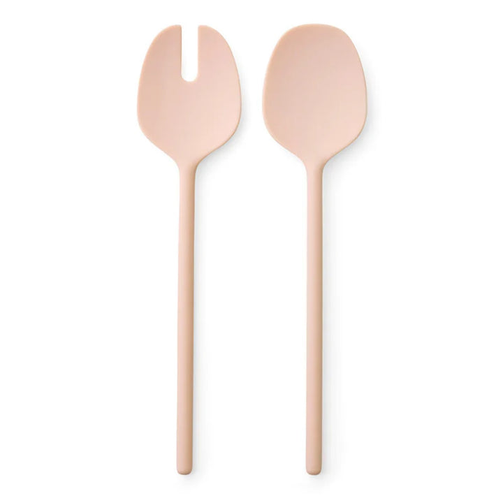 Two pink kitchen salad servers, one resembling a fork and the other a spoon, on a white background.