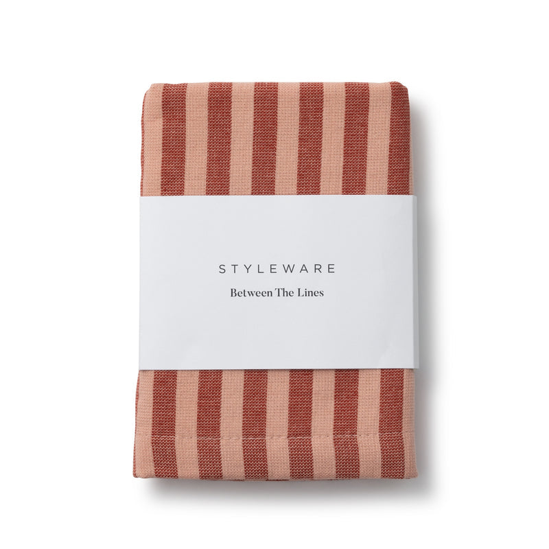 Folded tea towel with red and beige striped design on a white background, featuring 'Styleware' branding.