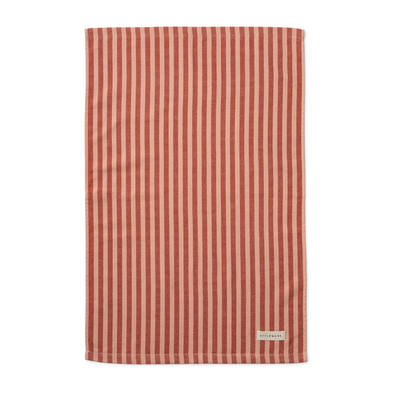 Red and beige striped tea towel with a brand label on a white background