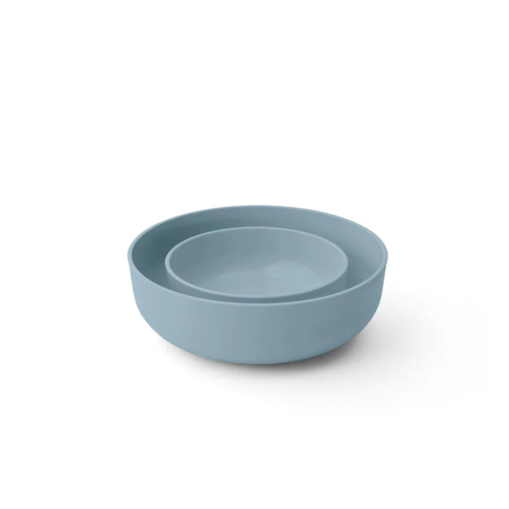 Blue plastic bowls on a white background