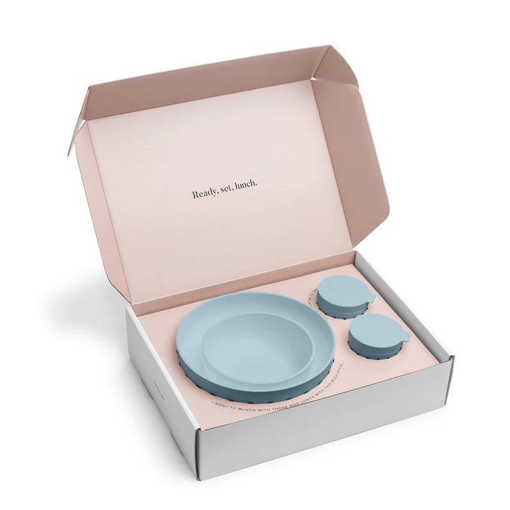 Set of blue plastic bowls in a box with 'Ready, set, lunch.' text on a white background