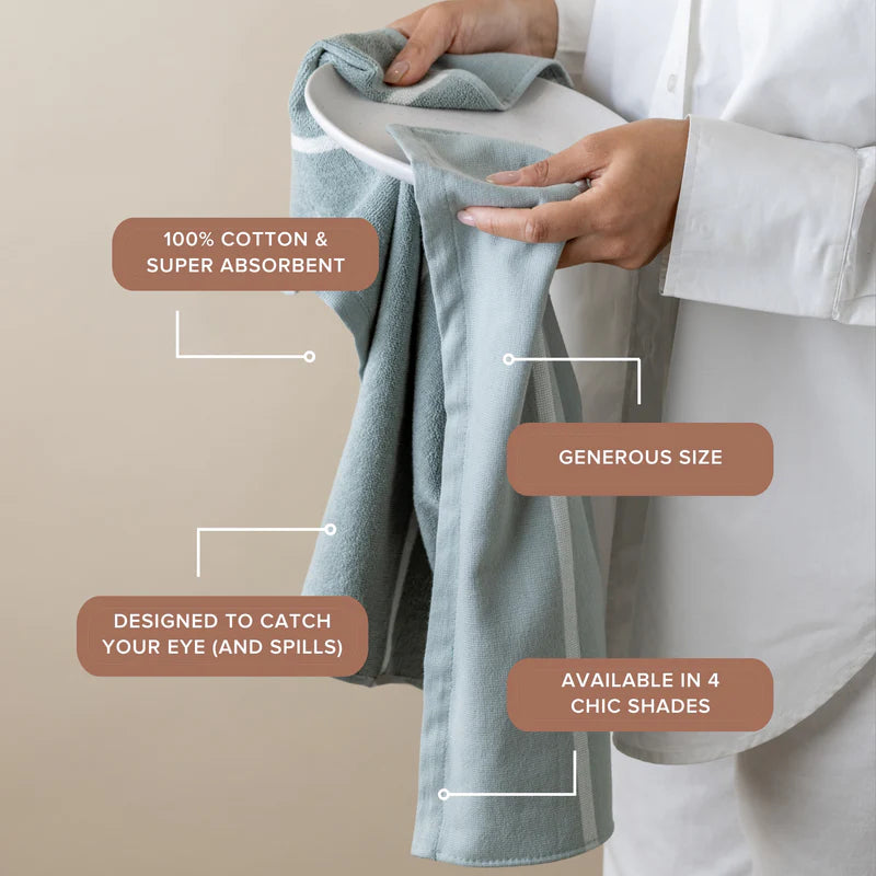 Person holding a folded towel with text highlighting features on a beige background