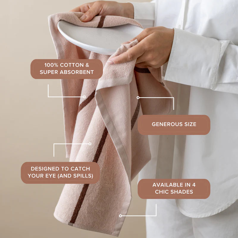 Person holding a pink towel with text highlighting features on a beige background