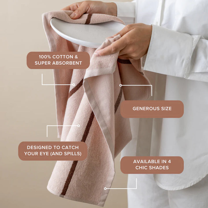 Person holding a pink towel with text highlighting features on a beige background