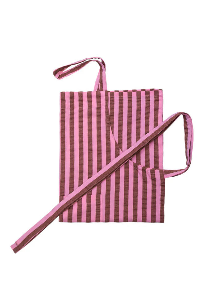Pink and maroon stripe apron on a white background