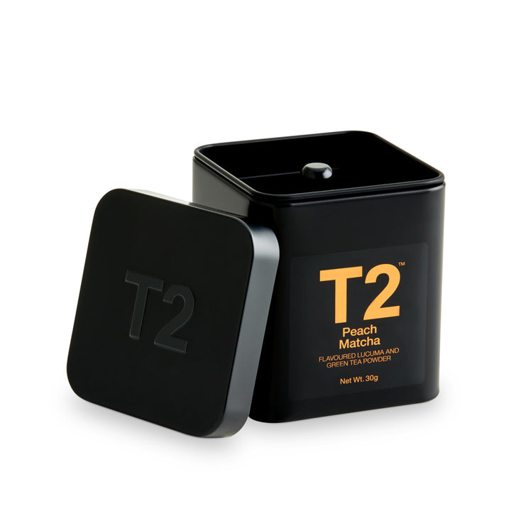 Black T2 tea container with 'Peach Matcha' flavor on a white background