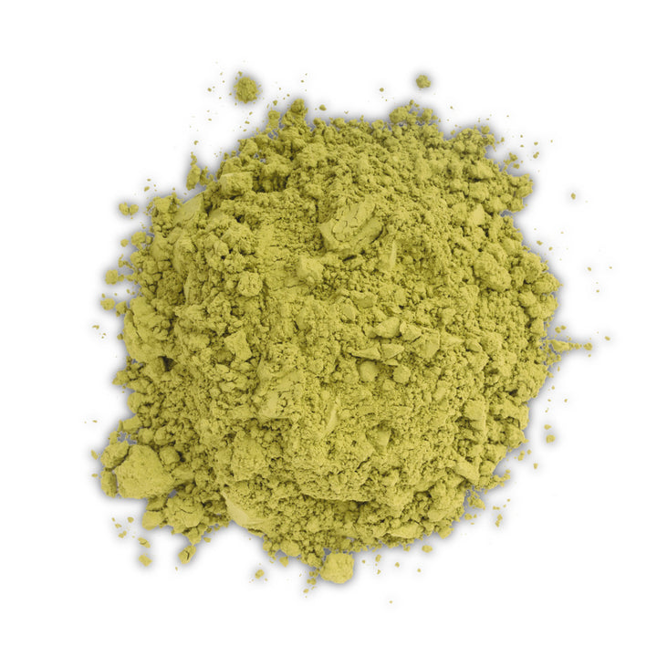 Green matcha powder on a white background