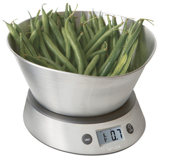 Digital kitchen scale with a bowl of green beans on a white background