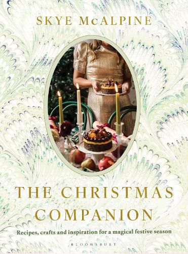 Book cover of 'The Christmas Companion' by Skye McAlpine with a decorative design and photo of a person holding a cake.