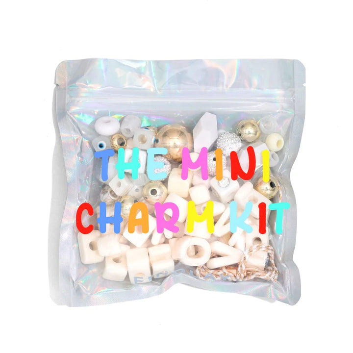 Mini charm kit packaging with colorful text on a white background
