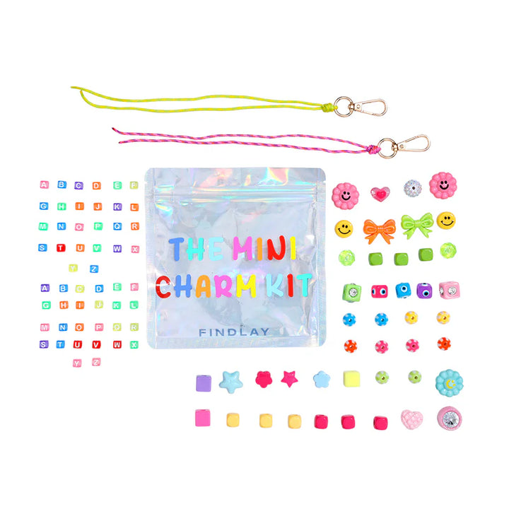 Mini charm kit with colorful charms and packaging on a white background