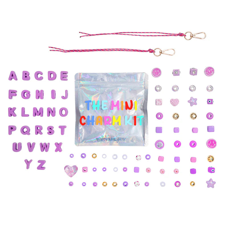 Mini charm kit with colorful charms and packaging on a white background