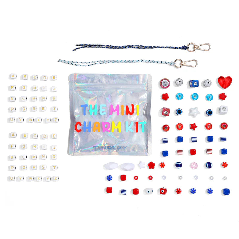 Mini charm kit with various charms and packaging on a white background