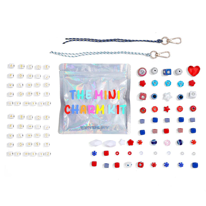Mini charm kit with various charms and packaging on a white background