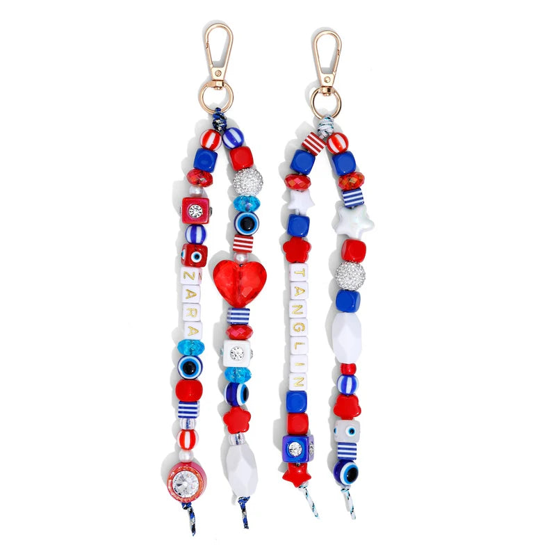 Two colorful beaded keychains with decorative elements on a white background