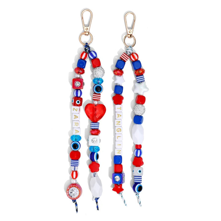 Two colorful beaded keychains with decorative elements on a white background