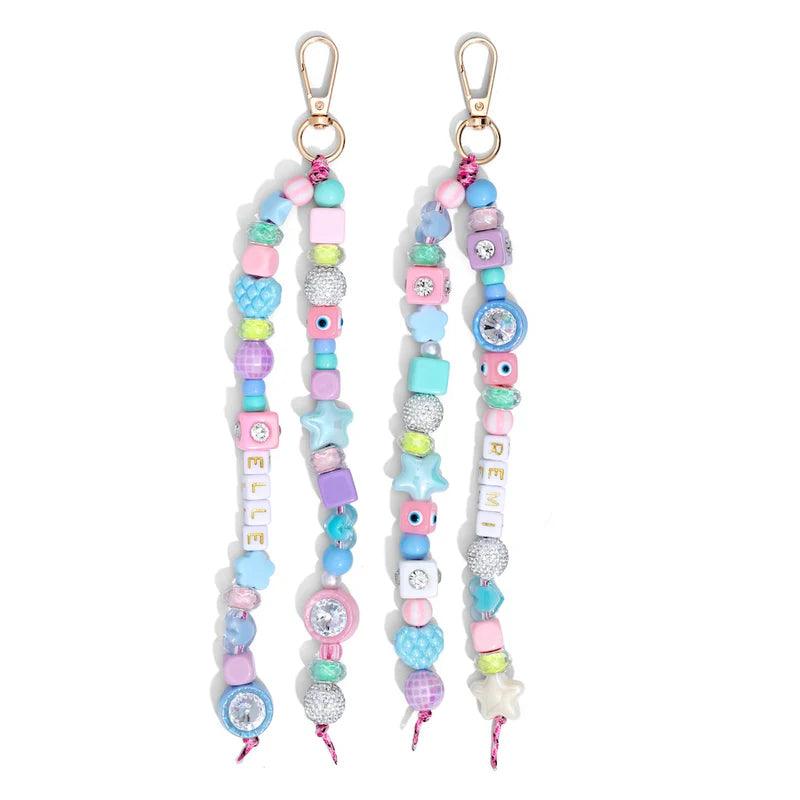 Two colorful beaded keychains with decorative elements on a white background