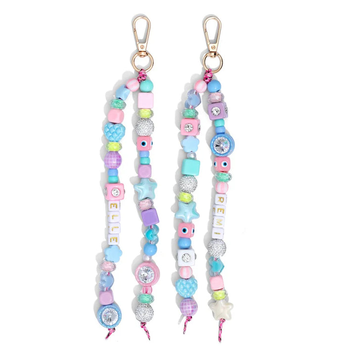 Two colorful beaded keychains with decorative elements on a white background