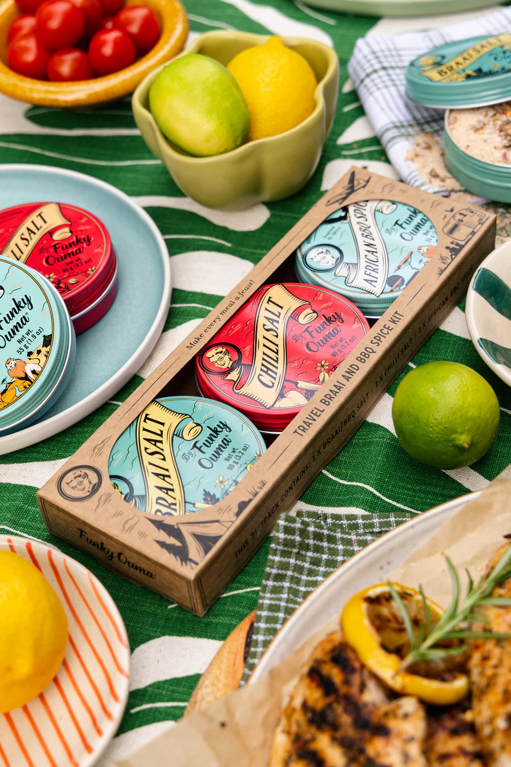 Tins on a table with lemons and tomatoes