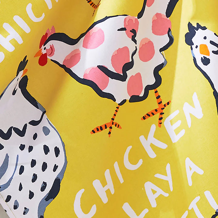 Yellow cotton tea towel chicken designs and text on a yellow background