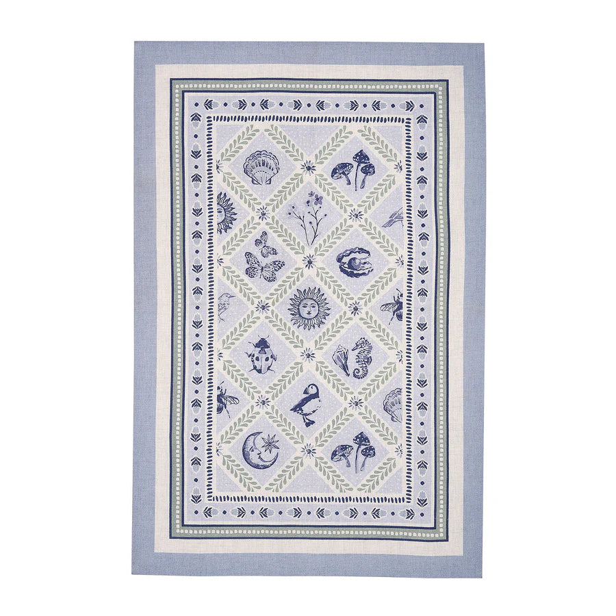 Cotton tea towel with coastal design on a white background