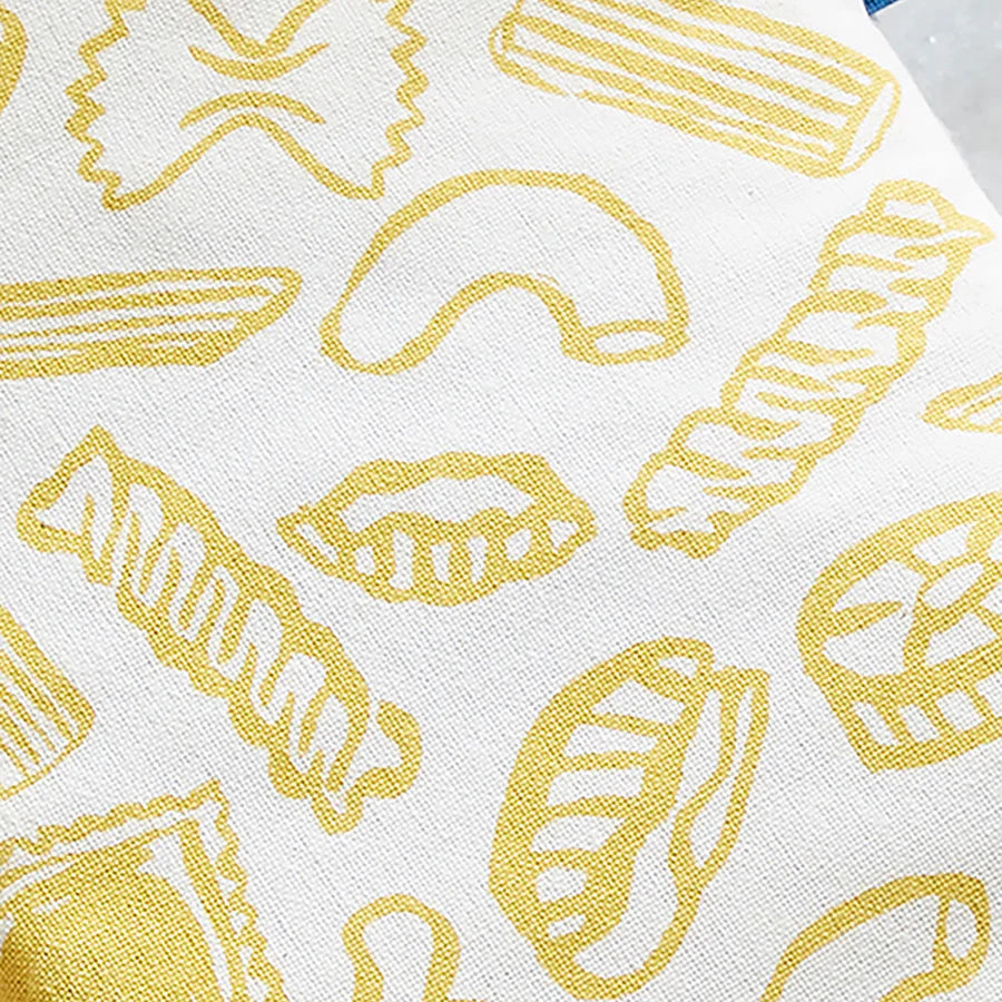 Pattern of yellow pasta shapes on a white background