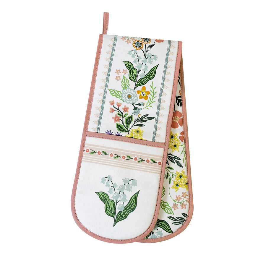 Floral patterned oven mitt on a white background