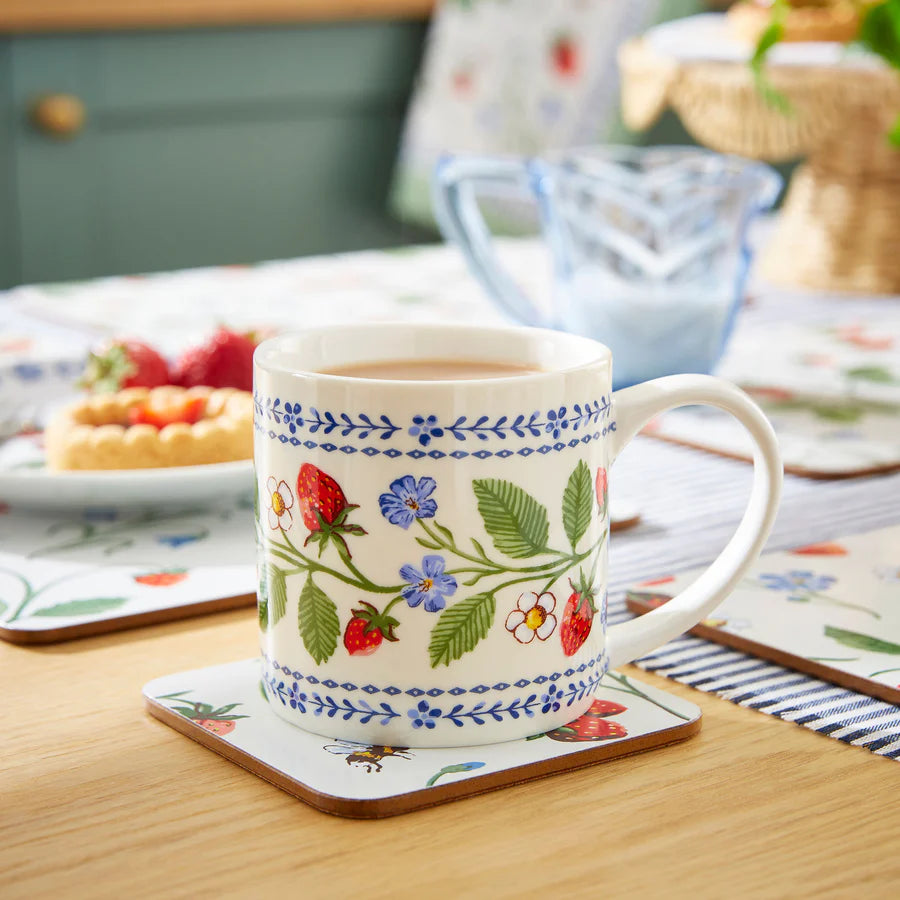 Decorative mug with floral patterns on a wooden table