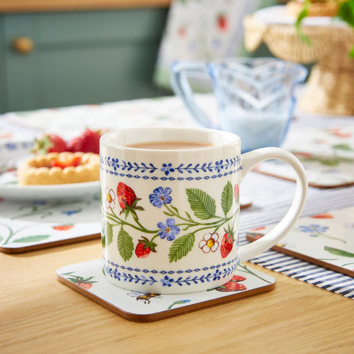 Decorative mug with floral patterns on a wooden table