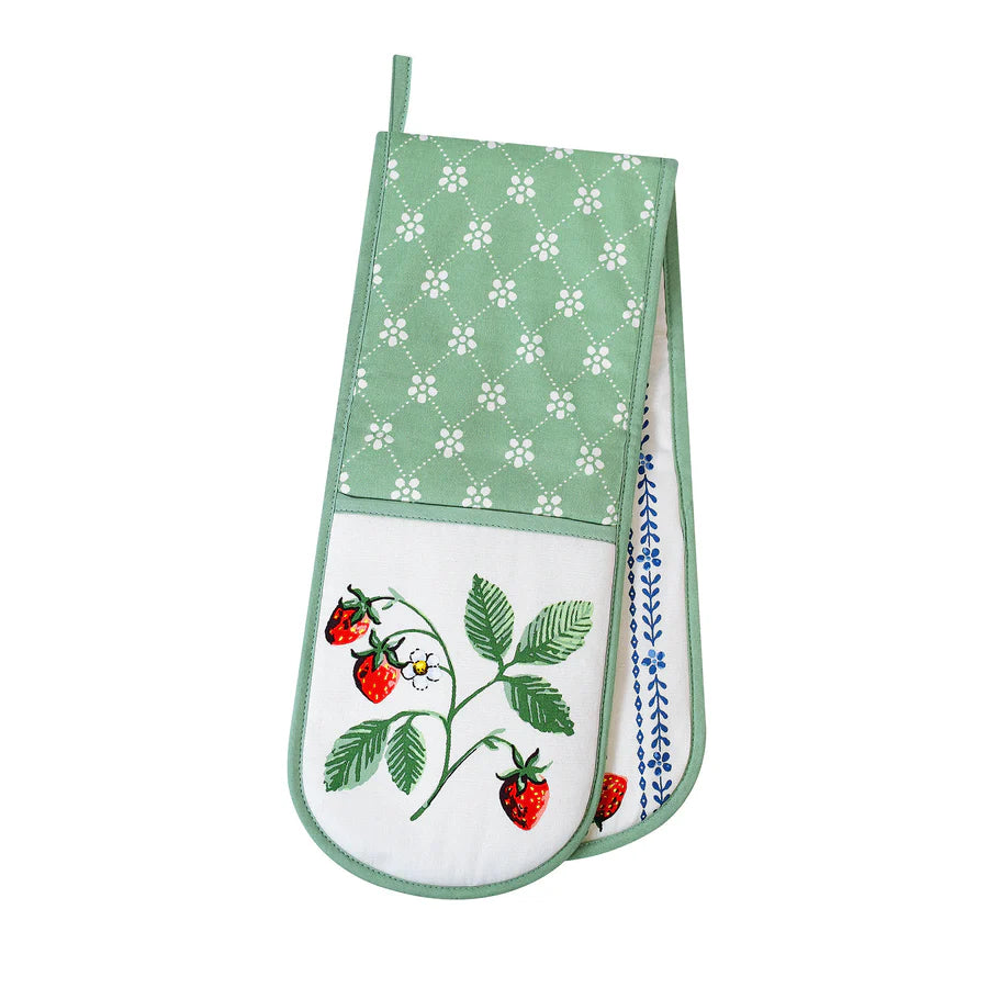 A doule oven glove with strawberry design on a white background