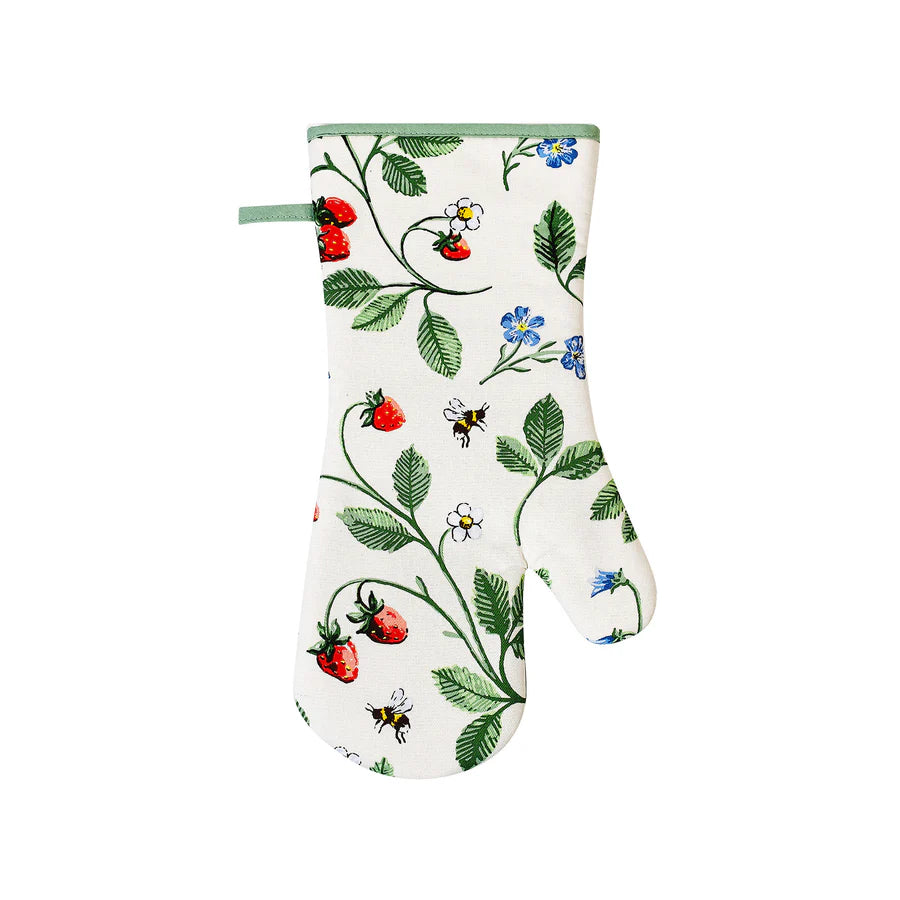 Oven mitt with garden-themed design on a white background