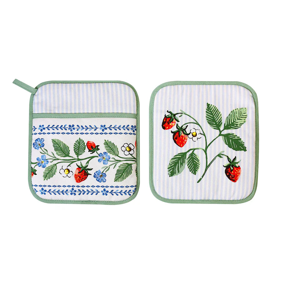 Two pot holders with strawberry design on a white background