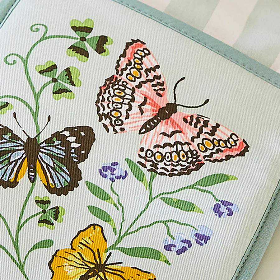 Butterfly and floral design on a fabric or paper surface