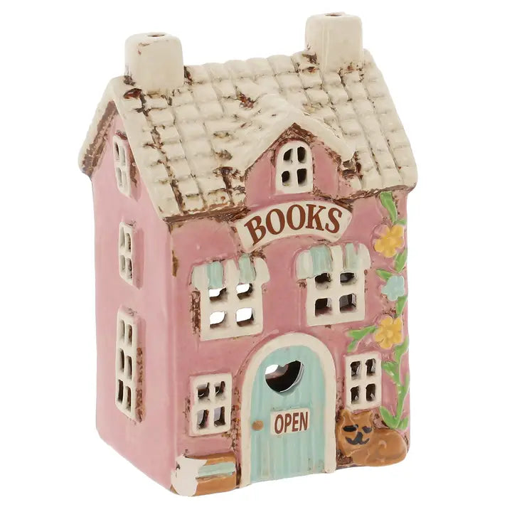Decorative house-shaped  tealight holder with 'Books' sign on a white background