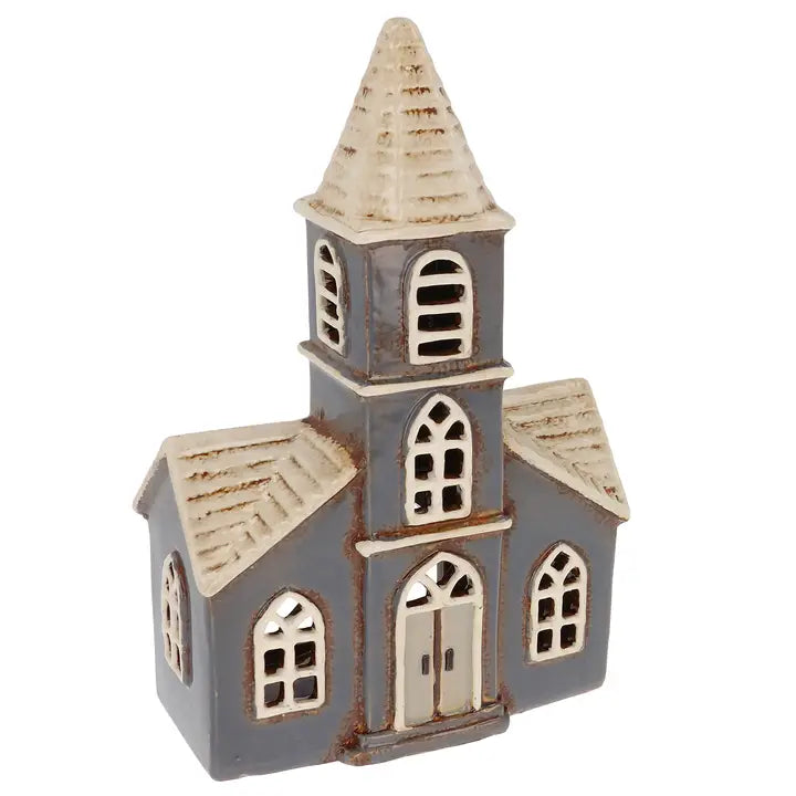 Small model of a church tealight holder with a steeple on a white background