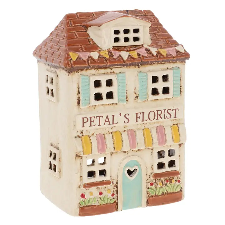 Decorative ceramic tealight holder with 'Petals Florist' on a white background