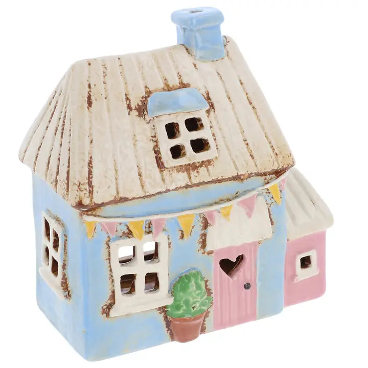 Ceramic tealight holder by Village Pottery on white background 