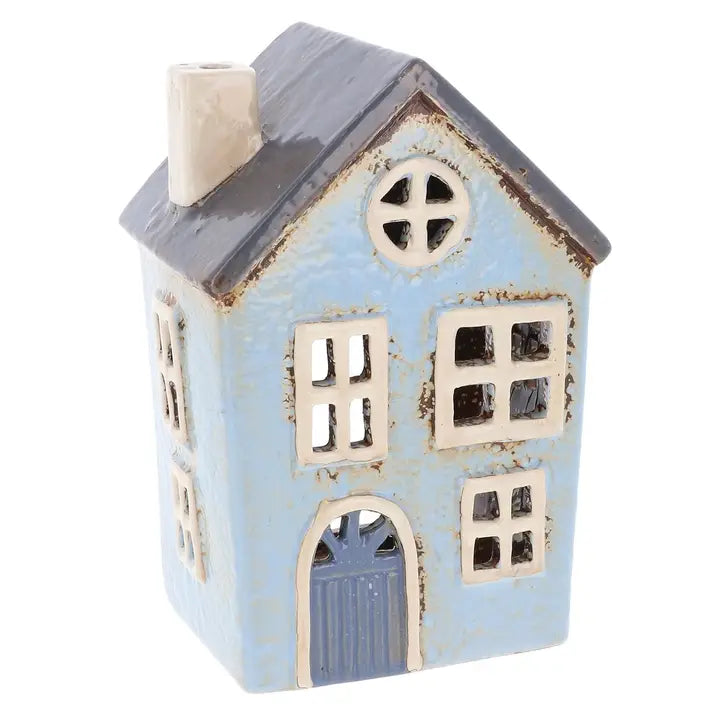 Decorative house-shaped tealight holder with a blue body and gray roof on a white background