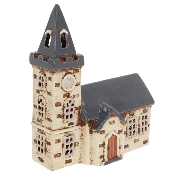Ceramic church with a steeple  tealight holder  on a white background
