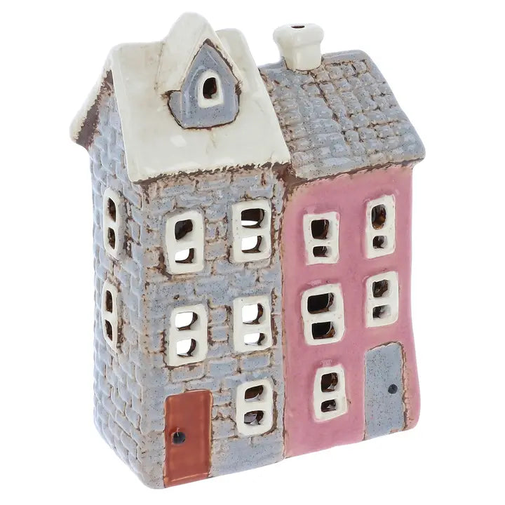 Ceramic house-shaped tealight holder with two stories, one gray and one pink, on a white background.