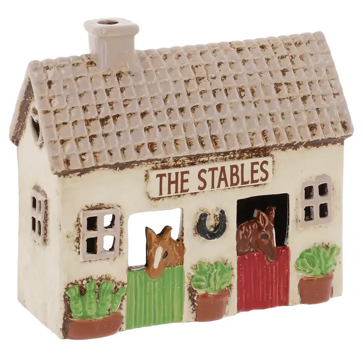 Ceramic stables  tealight holder with horses on a white background