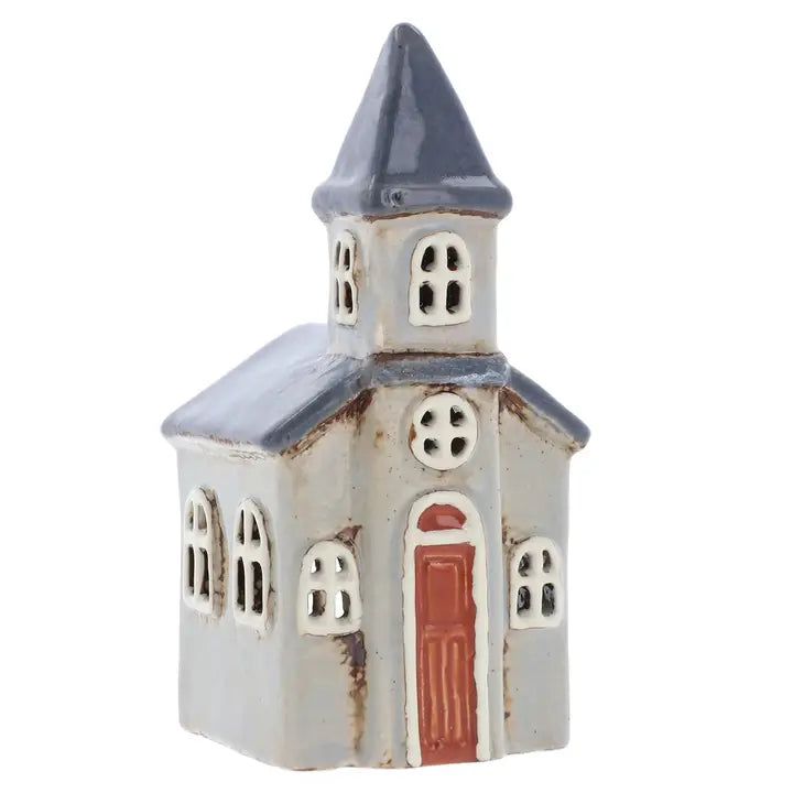 Small ceramic church  tealight holder  with a steeple on a white background